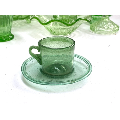 387 - A quantity of green glassware to include a handblown cup and saucer