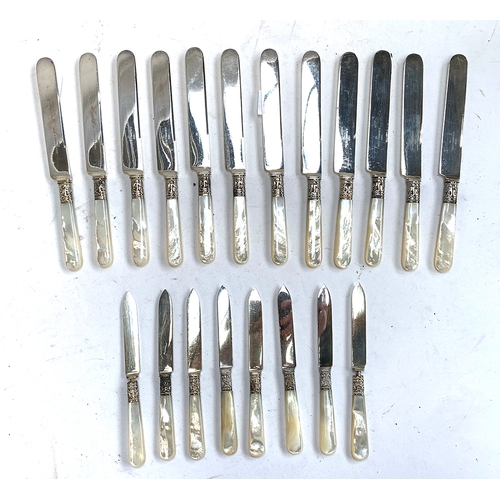 83 - A quantity of Victorian mother of pearl handled and silver collared knives, the blades engraved '183... 