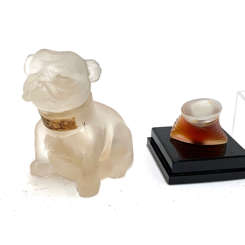 195 - A frosted glass perfume bottle in the form of a bulldog; together with others including one hand pai... 