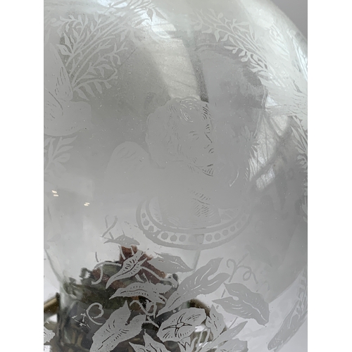 345 - A late Victorian Hinks & Sons brass Duplex oil Lamp, floral design to base, the glass shade etched w... 