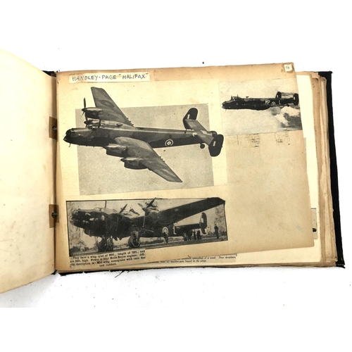 231 - An album relating to WWII aircraft containing a quantity of photos, newspaper clippings, cigarette c... 