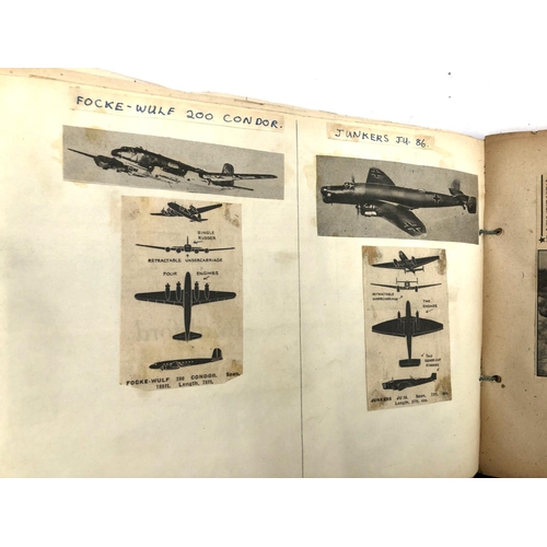 231 - An album relating to WWII aircraft containing a quantity of photos, newspaper clippings, cigarette c... 