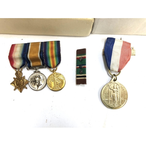 277 - A set of 3 miniature medals comprising 1914-15 star, victory and war medals, together with an Edward... 