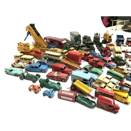 290 - A large quantity of play worn die cast model vehicles, mainly Dinky, to include TV mobile control ro... 