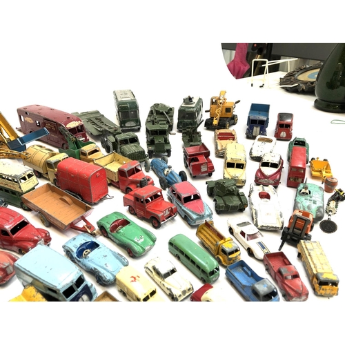 290 - A large quantity of play worn die cast model vehicles, mainly Dinky, to include TV mobile control ro... 