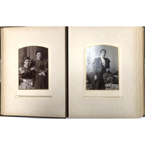 371 - Two Victorian leather photo albums containing a quantity of photographs (one spine af)