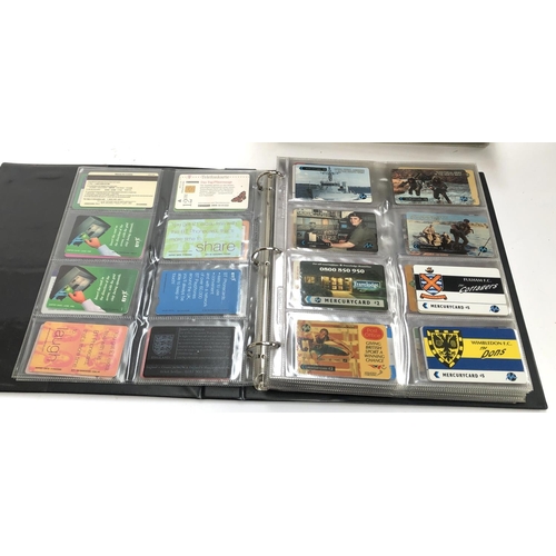 372 - A large quantity of PHQ cards in three albums, together with an album of phonecards