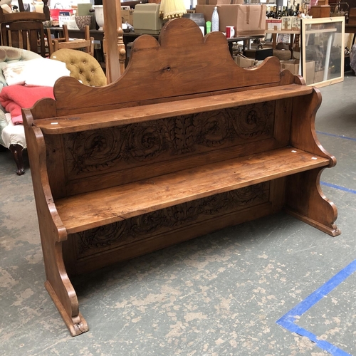 1148 - A carved upstand of two shelves, 141cmW