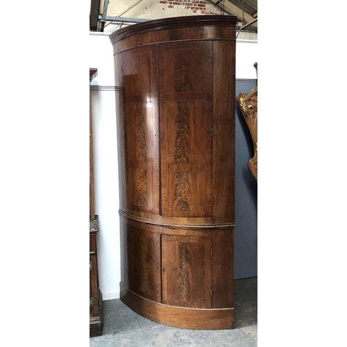 1155 - A massive George III bowfront standing corner cupboard, 240cmH