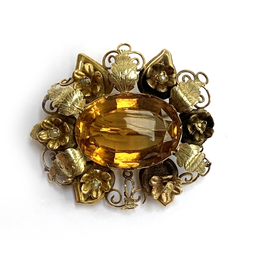 A two coloured gold brooch set with a central citrine surrounded by leaves and flowers (af), 3.7cmL, 7g