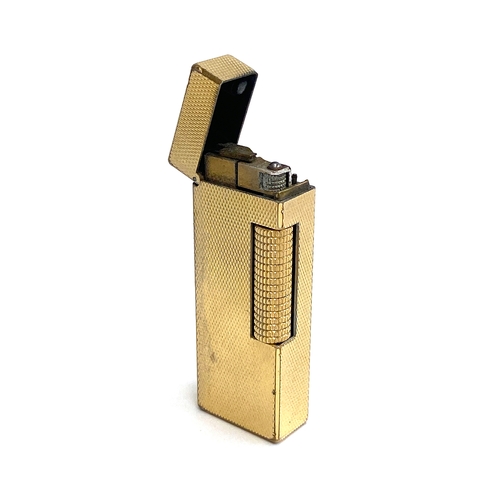 70 - A vintage Dunhill Rollagas gold plated lighter, US RE24163k 6.5cm high, in original box with papers