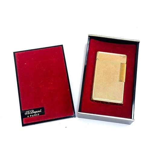 71 - A gold plated lighter by S. T. Dupont, 5.8cm high, in original box