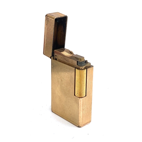 71 - A gold plated lighter by S. T. Dupont, 5.8cm high, in original box