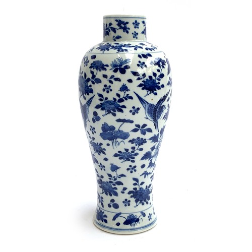 180 - A Chinese blue and white porcelain vase of baluster form, decorated with birds and butterflies among... 