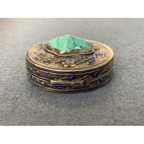 82 - An early 20th century Chinese export silver and enamel pill box set with a central turquoise stone, ... 