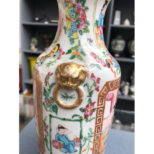 221 - A late 19th century Chinese famille rose vase of baluster form with applied lion mask handles, depic... 