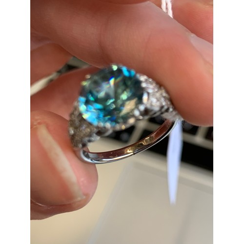 9 - An early 20th century white metal mounted blue zircon and diamond ring, the zircon approx. 4.7cts, t... 