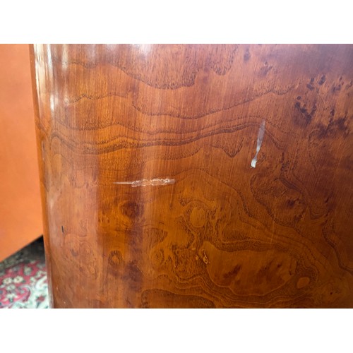 727 - A pair Austrian birch veneer bowfront bedside cabinets, c.1935, three quarter gallery back, over thr... 