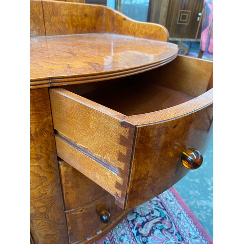 727 - A pair Austrian birch veneer bowfront bedside cabinets, c.1935, three quarter gallery back, over thr... 