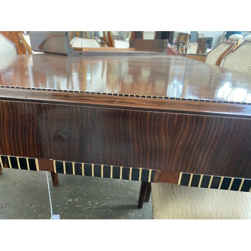 723 - A French Art Deco maccasar ebony dining table, rectangular moulded top, on fluted tapering legs, 176... 