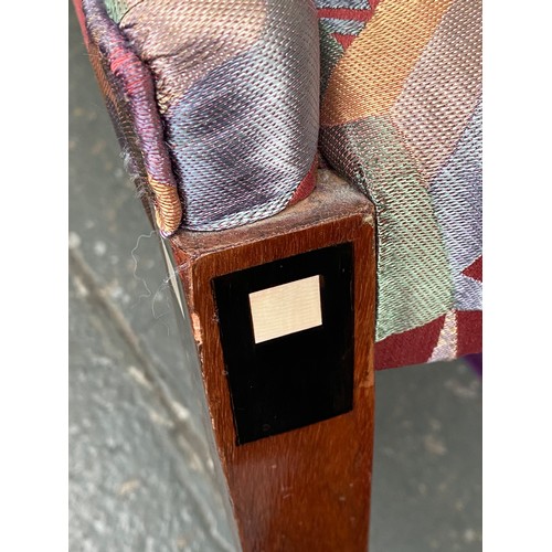 730 - A pair of French Art Deco tub chairs, raised on square tapered legs with ebonised and ivorine inlay,... 