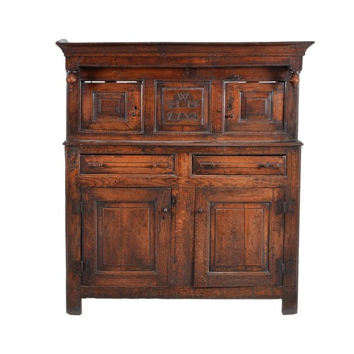 367 - An oak court cupboard, first half 18th century, the central panel inscribed WHM 1732, 154cm high, 14... 