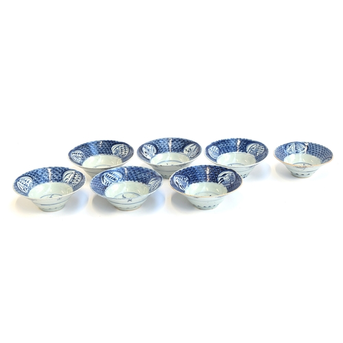 106 - Seven 19th century Chinese export blue and white porcelain bowls, six approx. 18cm to 18.5cm; one sm... 