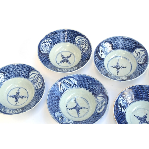 106 - Seven 19th century Chinese export blue and white porcelain bowls, six approx. 18cm to 18.5cm; one sm... 