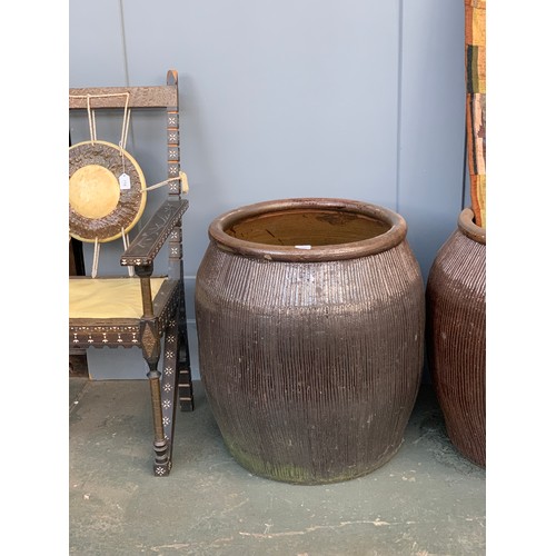 679 - A pair of very large terracotta planters, 63cm diameter, 68cm high, one cracked