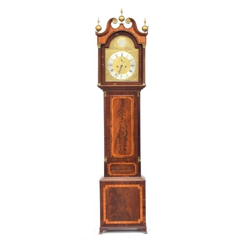 700 - A George III mahogany long cased clock with swan neck pediment and three balled finials, over a dome... 