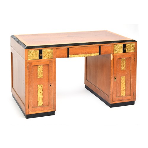 705 - A French Art Deco pedestal desk, parcel gilt and ebonised, with carved foliate and scallop panels, t... 