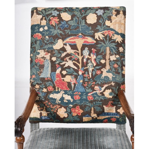 769 - An early 18th century Continental walnut high back armchair, the back upholstered with needlework pa... 