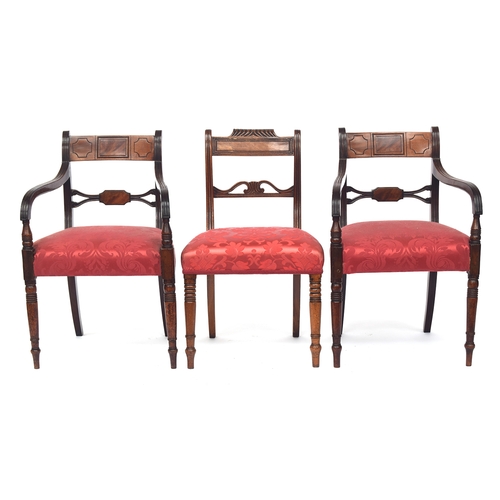 813 - A set of six William IV mahogany dining chairs, the ebony inlaid top rail on reeded scroll supports,... 