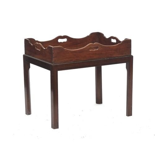 824 - A 19th century mahogany butler's tray, shaped gallery with handle cutouts on all sides, on a later s... 