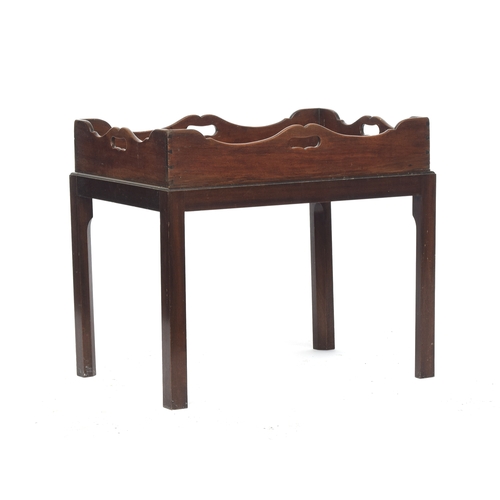 824 - A 19th century mahogany butler's tray, shaped gallery with handle cutouts on all sides, on a later s... 