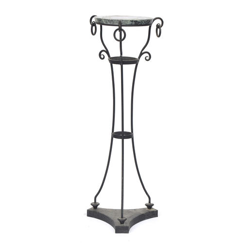 858 - A wrought iron and serpentine marble gueridon pot stand, circular top, the three scrolling supports ... 