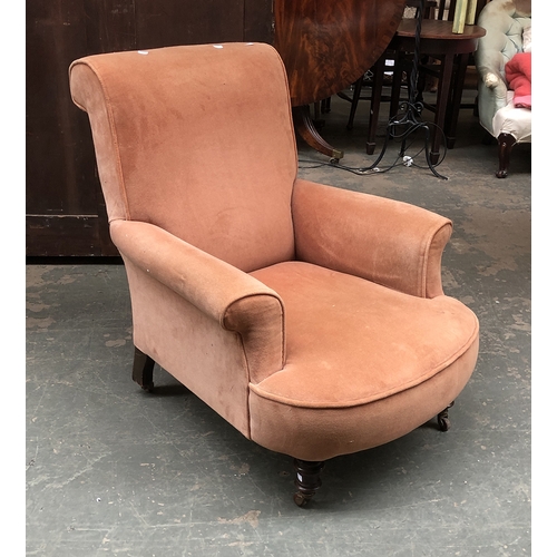 950 - A late 19th century armchair on turned front legs and casters