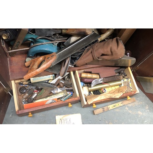 956 - A teak carpenters cabinet, fitted interior, hung with various tools, to include Marples chisels, 66x... 