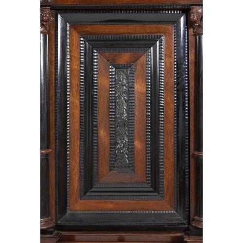 972 - A massive Dutch rosewood and ebonised schrank in 17th century style, 18th century and later, the doo... 