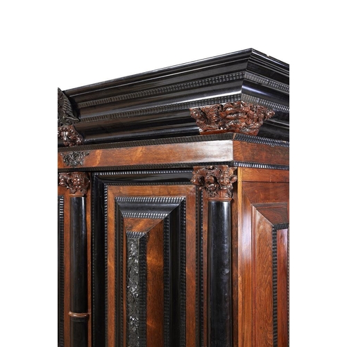 972 - A massive Dutch rosewood and ebonised schrank in 17th century style, 18th century and later, the doo... 