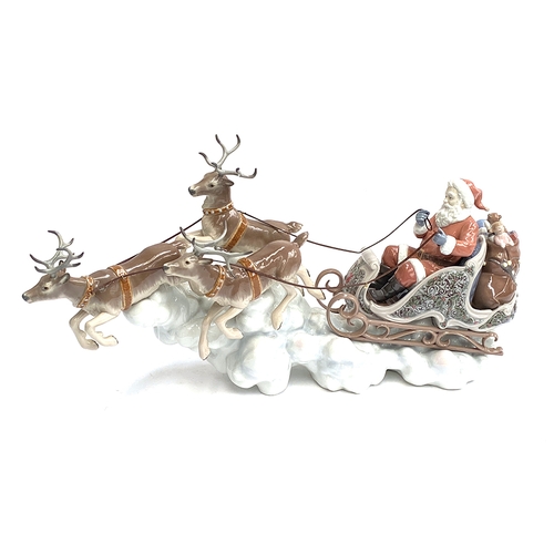 164 - A Lladro figurine 'Santa's Midnight Ride Sleigh', model no. 1938, modelled by Alfredo Lorenz, no. 52... 