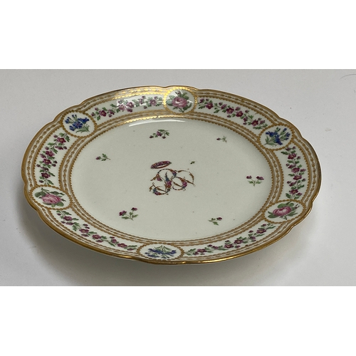 264 - A late 18th century French Clignancourt porcelain plate, florally monogrammed 'B' above a gilt ciphe... 