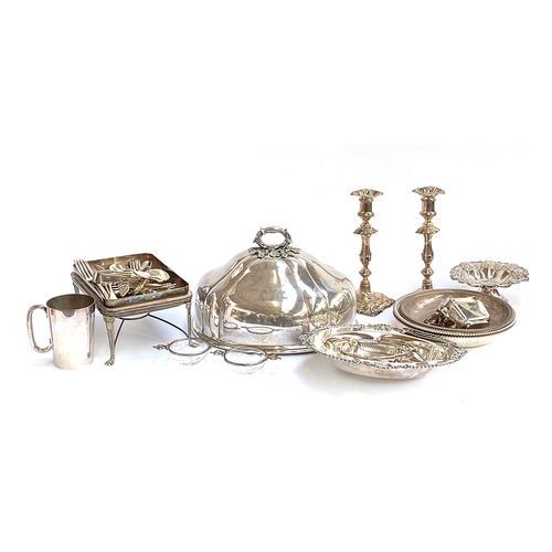 83 - A mixed lot of plated wares to include a large meat cloche, a pair of candlesticks, a pair of silver... 