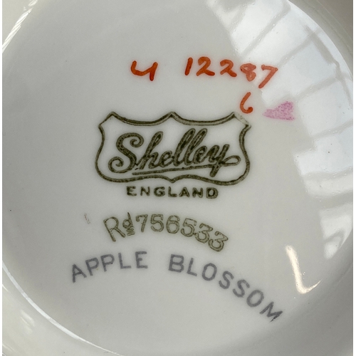 130 - A Shelley Apple Blossom art deco tea set, 28 pieces, comprising teapot, coffee pot, tea cups (6), sa... 