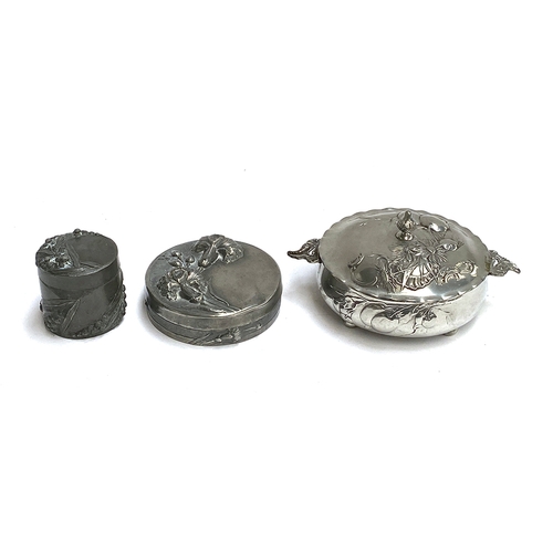 276 - An art nouveau Etain fin Garanti pewter lidded box, signed Emenault(?), 13.5cmD; together with a sma... 