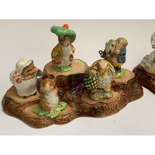 127 - 15 Beatrix Potter figurines comprising 9 Beswick and 6 Royal Albert, together with three Beswick tre... 