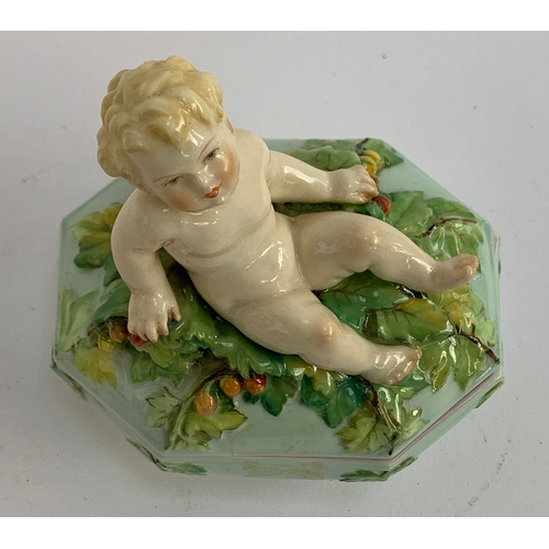 186 - A rare early 20th century Royal Worcester porcelain box, modelled by Henri Bargas, the lid surmounte... 