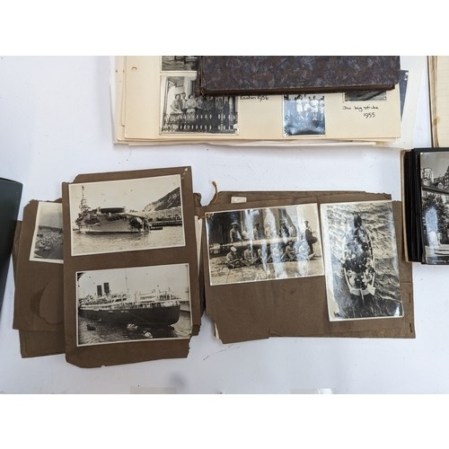 418 - A large quantity of 20th century holiday photographs and postcards, from the 1920s to early 60s; to ... 