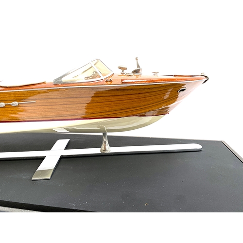 287 - Model boat interest: A scale model of a Venetian motor launch, probably Riva, 64cm long, within a pe... 