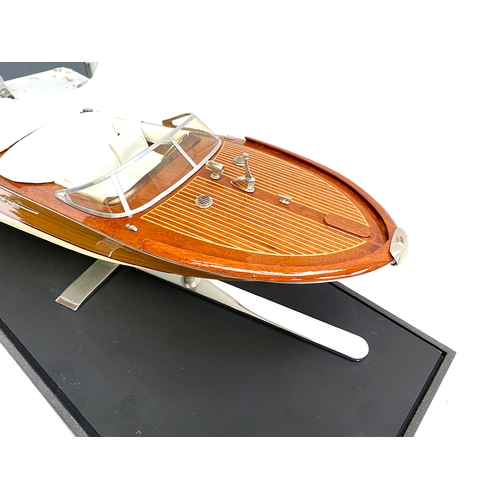 287 - Model boat interest: A scale model of a Venetian motor launch, probably Riva, 64cm long, within a pe... 